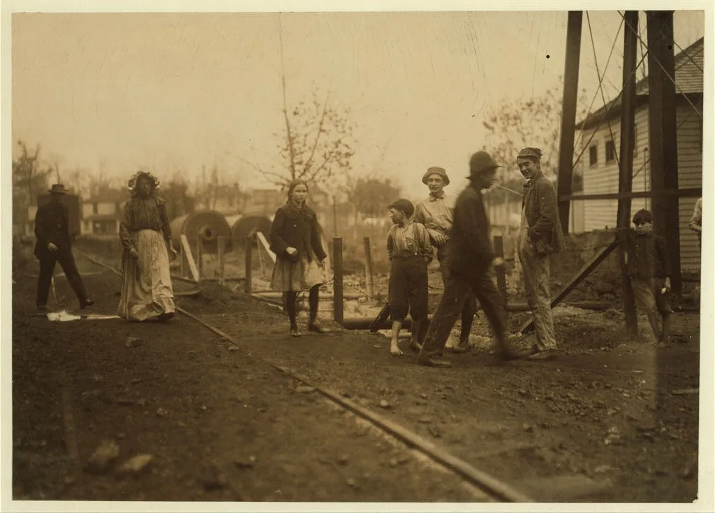 Noon hour at Avondale Mills. I saw this young girl working at her…, Alabama, 1910