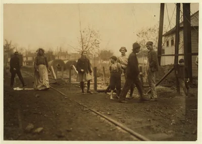 Noon hour at Avondale Mills. I saw this young girl working at her…, Alabama, 1910