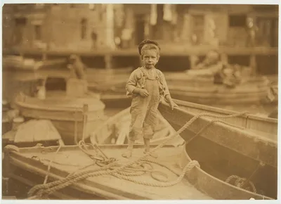 Truant hanging around boats in the harbor during school hours. …, Massachusetts, 1909
