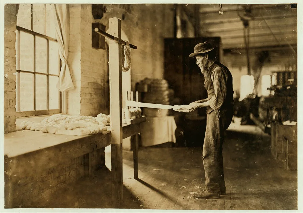 Rhodes Mfg. Company, Lincolnton, N.C. Old man inspecting yarn. Been…, North Carolina, 1908