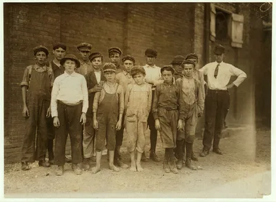 Group of doffers in Pell City Cotton Mill posed by the Overseer.…, Alabama, 1910
