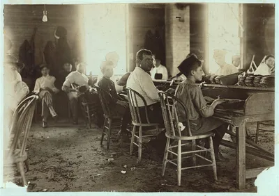 These boys were surely under 14. Cigarmakers in Englehardt Co.,…, Florida, 1909