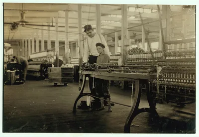 Young "Band-boy" and overseer, Yazoo City Yarn Mills.  Location:…, Mississippi, 1911