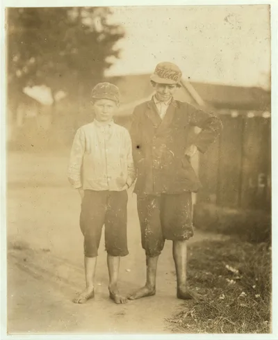 Guy Haywood, 10 years old, helps his brother. Harvey doff[s] in…, Georgia, 1913