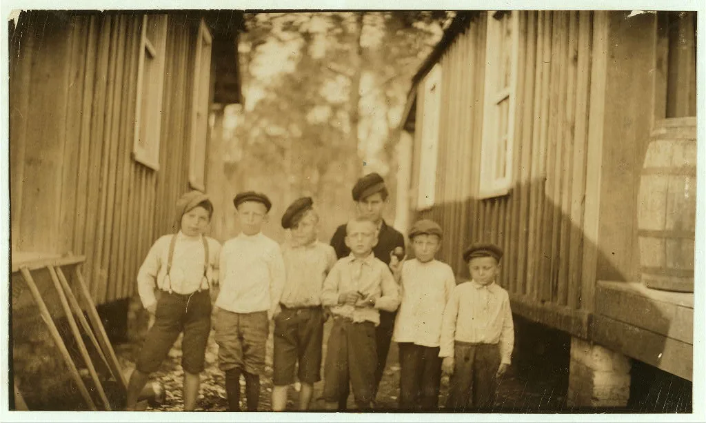All except the largest boy shuck oysters at Pass Christian. …, Mississippi, 1911