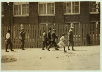 Group going out at noon from the Kilburn Mills. Little girl running…, Massachusetts, 1911