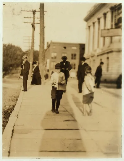 Newsboy at P.O. Said he was 8 years old.  Location: Burlington,…, Vermont, 1910