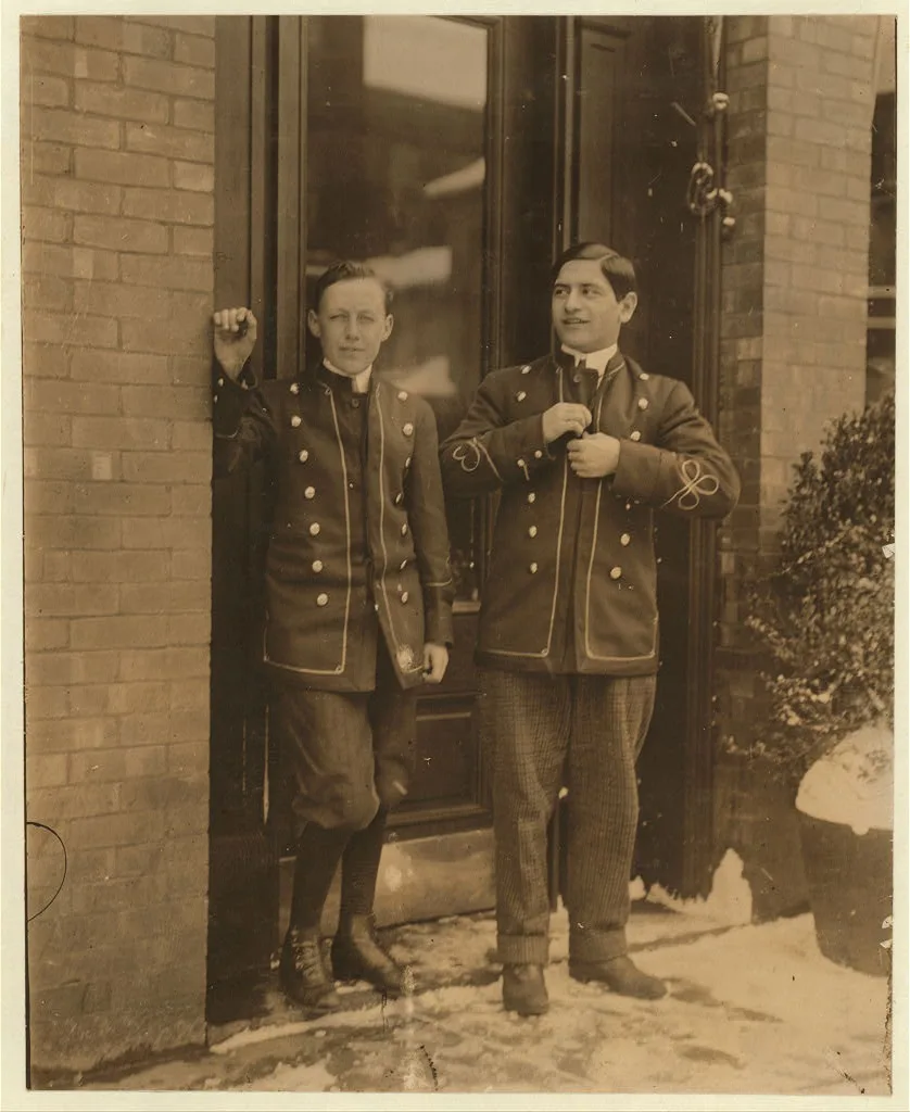 Bell boys at the Hotel Martin, work until midnight.  Location: Utica,…, New York (State), 1910