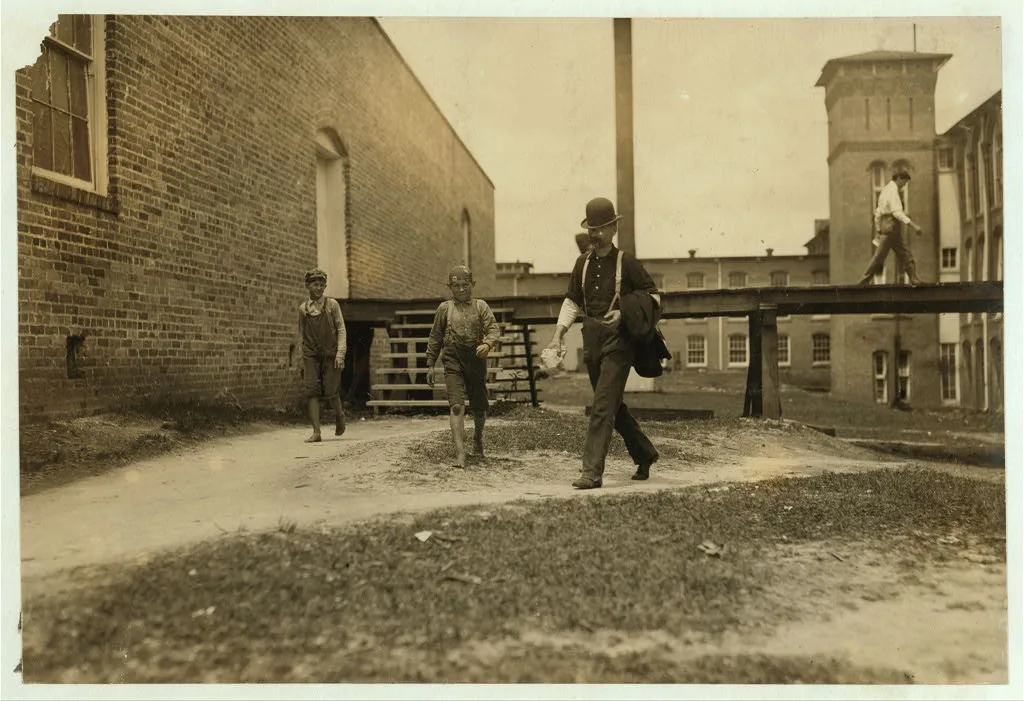 Noon hour. Two of the young doffer-boys working in the Laurel Cotton…, Mississippi, 1911