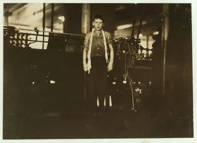 [Dosilav Loselle, 6 Gardner Rd. (At his Machine) Young band boy in 5…, Massachusetts, 1911