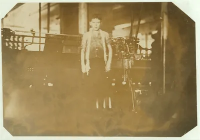 [Dosilav Loselle, 6 Gardner Rd. (At his Machine) Young band boy in 5…, Massachusetts, 1911
