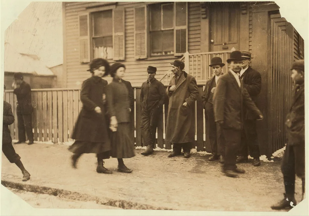[Young girls running gauntlet of men making remarks (sometimes…, Massachusetts, 1912