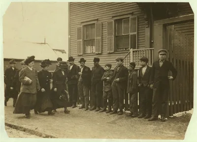[Young girls running gauntlet of men making remarks (sometimes…, Massachusetts, 1912