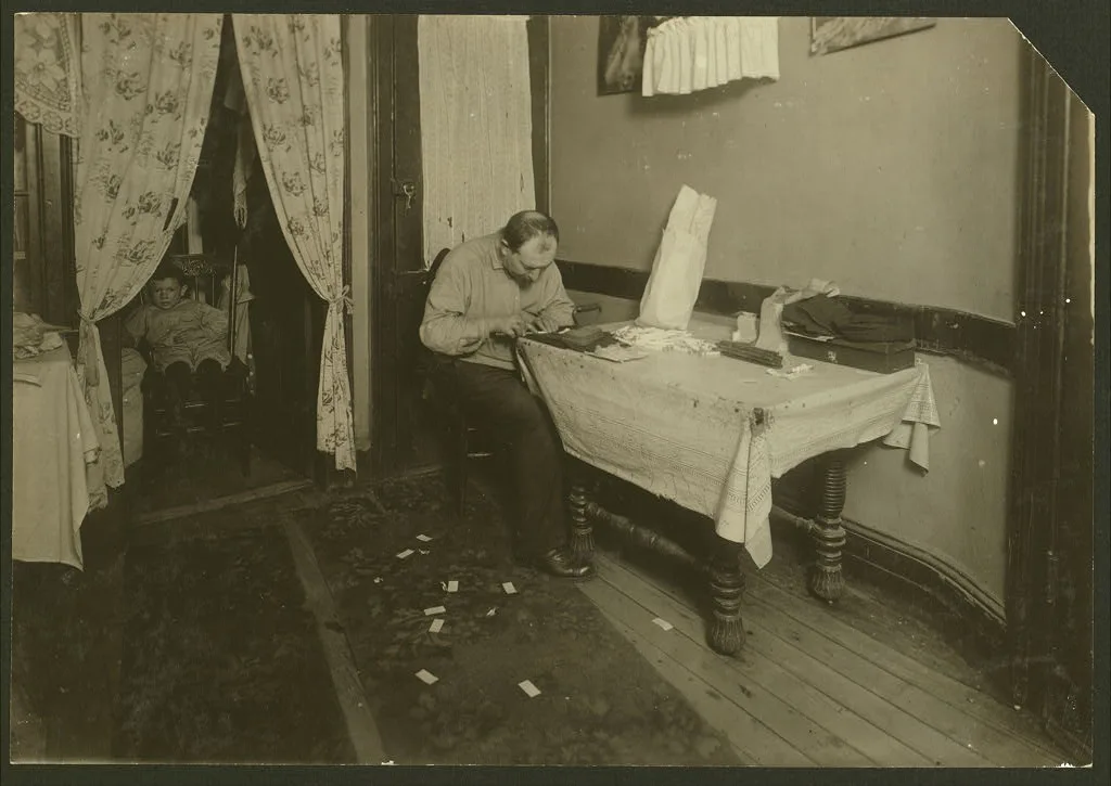 Rolling cigarette cases in tenement home. (For complete details see…, New York (State), 1912