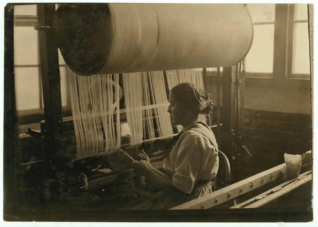 Girl at the drawing-in-frame of the weave-room, Lorraine Mills,…, Rhode Island, 1912