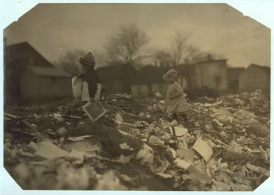 Two children going through the "Dumps."  Location: [Rhode Island?], 1912