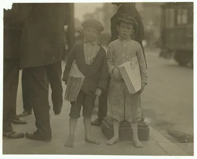 9 year old newsie and his 7 year old brother "Red." Tough specimen of…, California, 1915