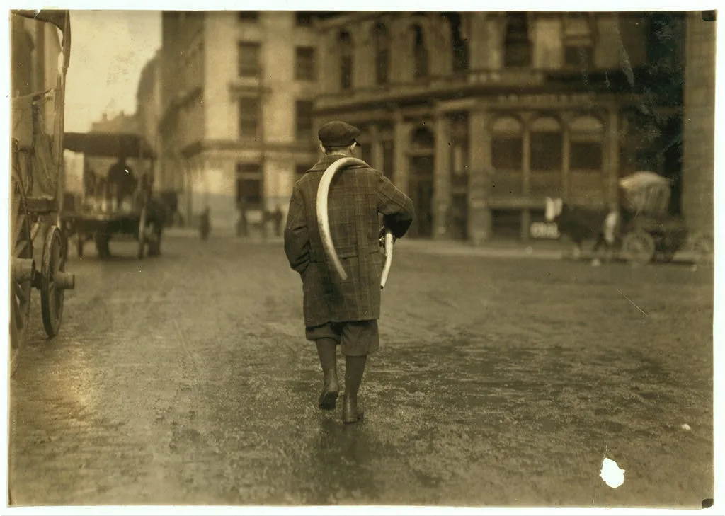 [Street scenes. Delivery boy.]  Location: [Boston, Massachusetts], 1917