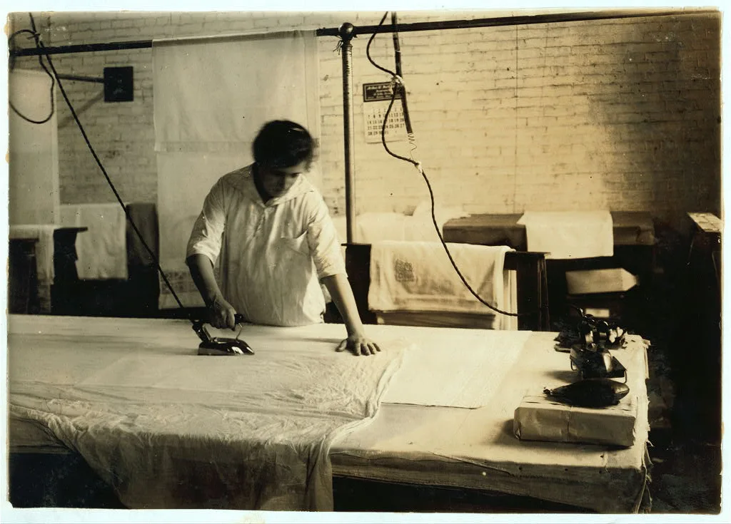 Sadie McGurin, 15 years old. Pressing curtains at Boutwell,…, Massachusetts, 1917
