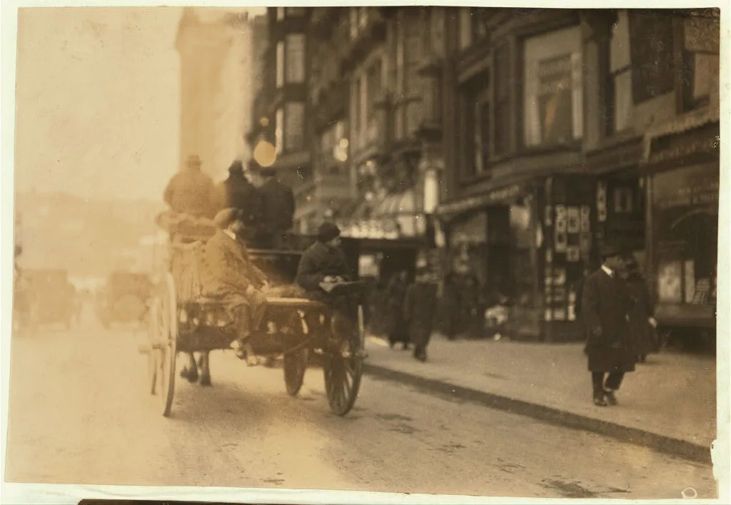 P.M. Delivery boys on Tremont Street, "getting a hitch".  Location:…, Massachusetts, 1917