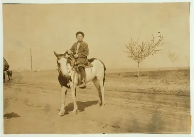 Bartrum Choate, a 12-year-old boy driving colts to town. Works for…, Oklahoma, 1917