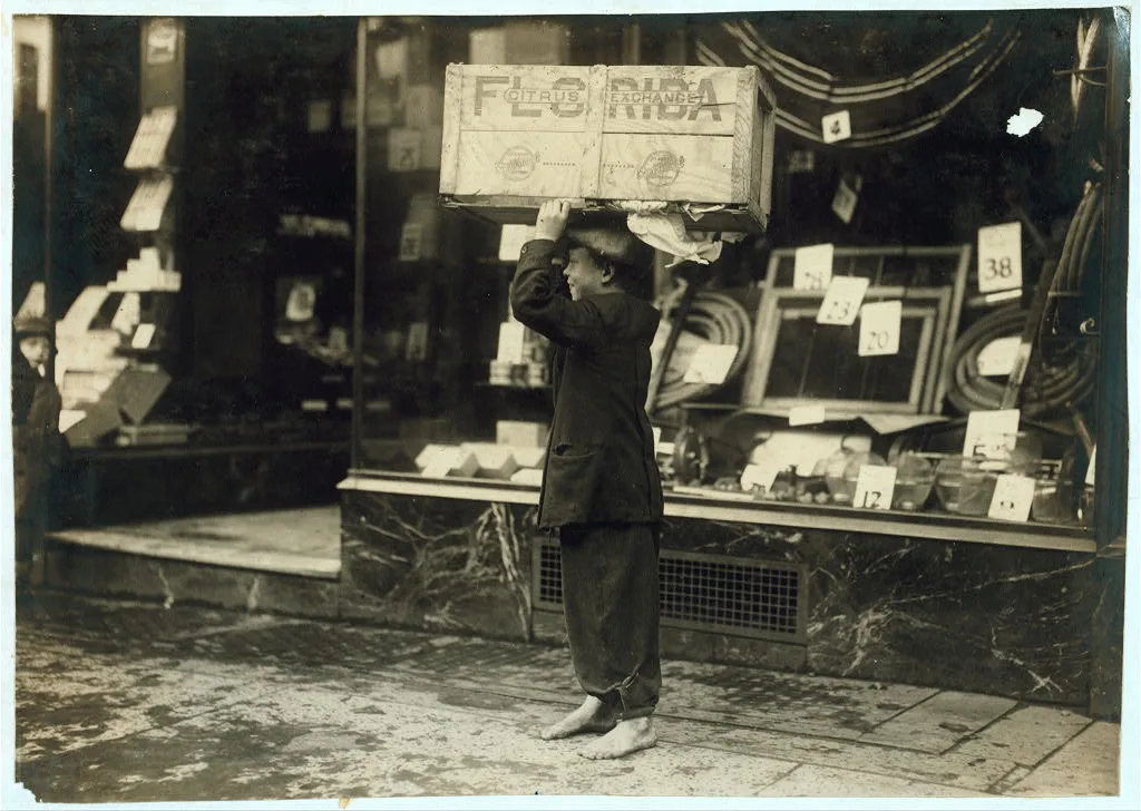 Toting wood. Location: Fall River, Massachusetts, 1916