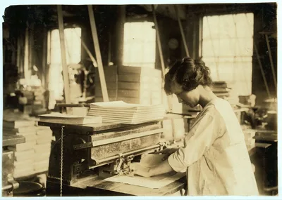 15-year old girl punching sheets. Boston Index Card Co.  Location:…, Massachusetts, 1917