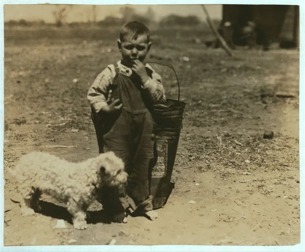 [Small boy standing outdoors with dog].  Location: Oklahoma City,…, 1917