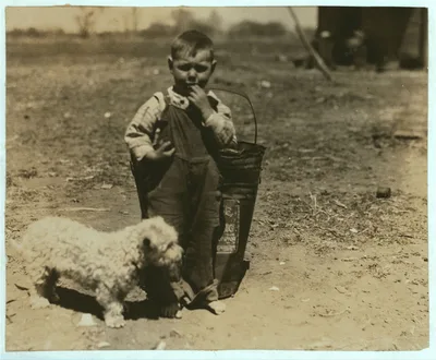 [Small boy standing outdoors with dog].  Location: Oklahoma City,…, 1917